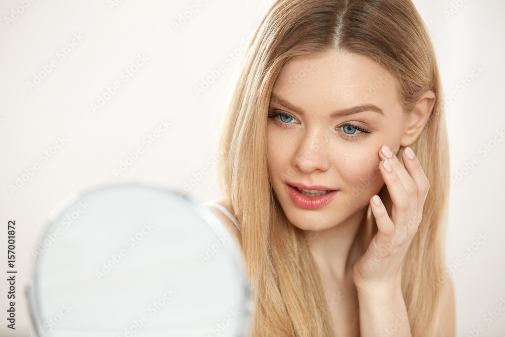 Beauty Face Care. Girl With Healthy Skin Looking In The Mirror Beauty Face Care. Girl With Healthy Skin Looking In The Mirror