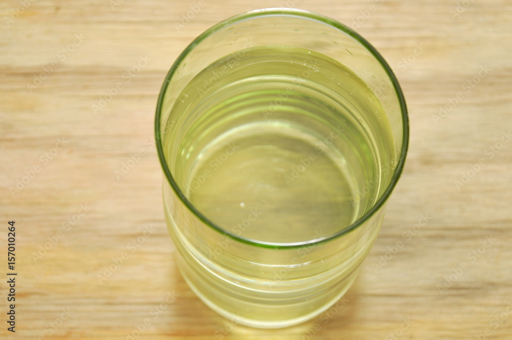 clear freshwater in glass on wooden board clear freshwater in glass on wooden board