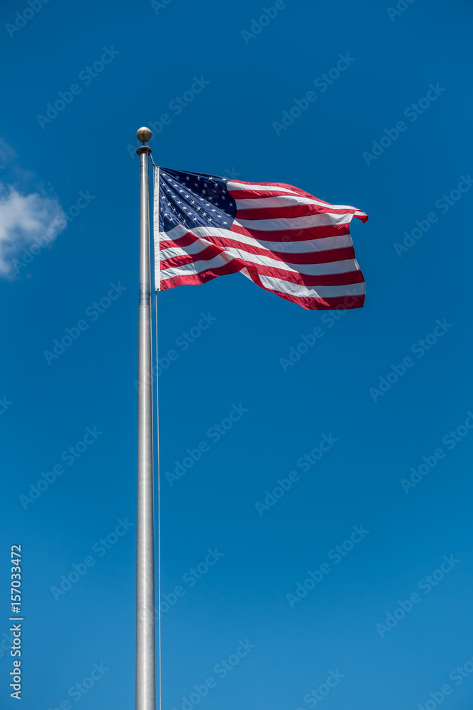 Fototapeta premium American Flag With Blue Sky