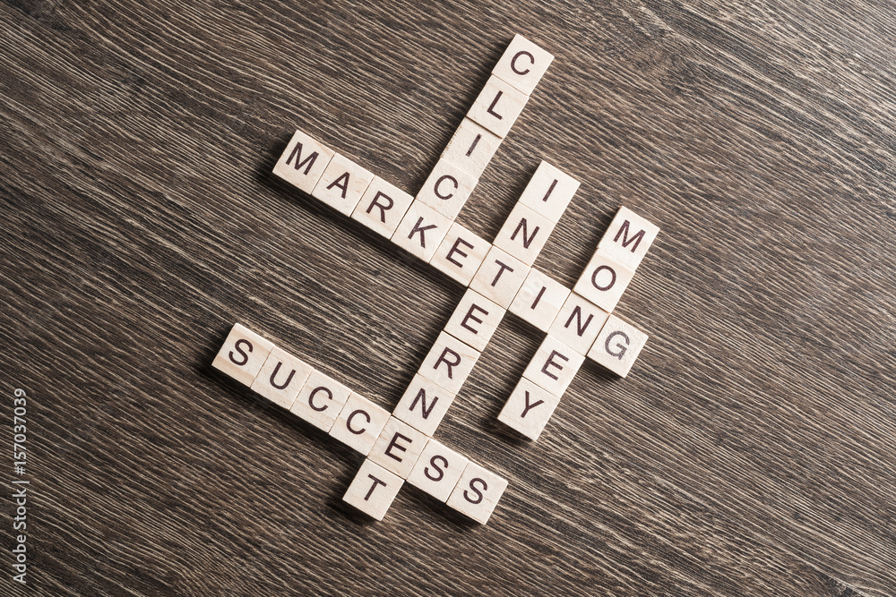 Conceptual business keywords on table with elements of game making crossword Conceptual business keywords on table with elements of game making crossword
