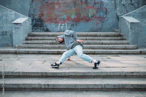 Male rapper posing on the street, urban dancing © Nomad_Soul