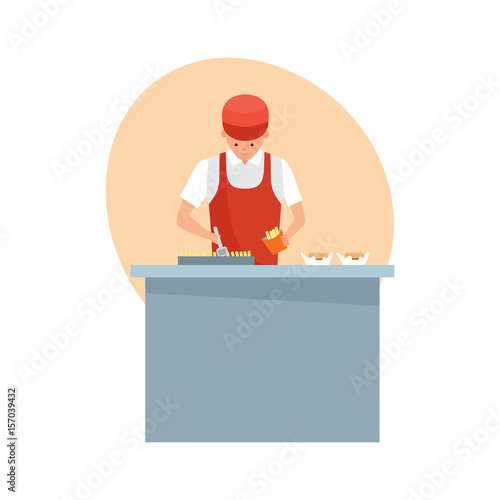 Seller, is preparing french fries and burgers behind the counter.