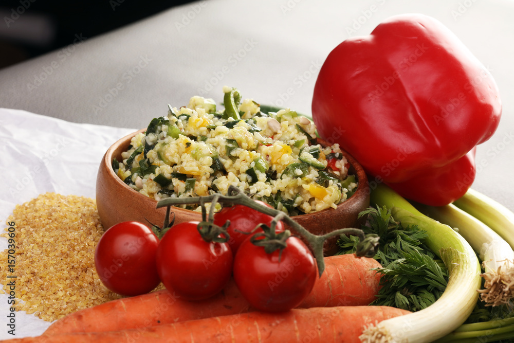 Tabbouleh salad with bulgur, parsley and vegetables -diet concept Tabbouleh salad with bulgur, parsley and vegetables -diet concept