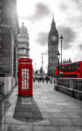 red bus and telephone box in front of Big Ben