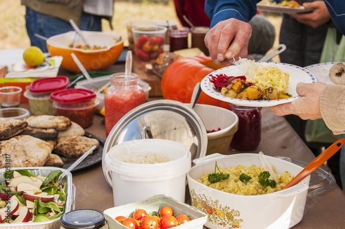Group of people having lunch outdoors.