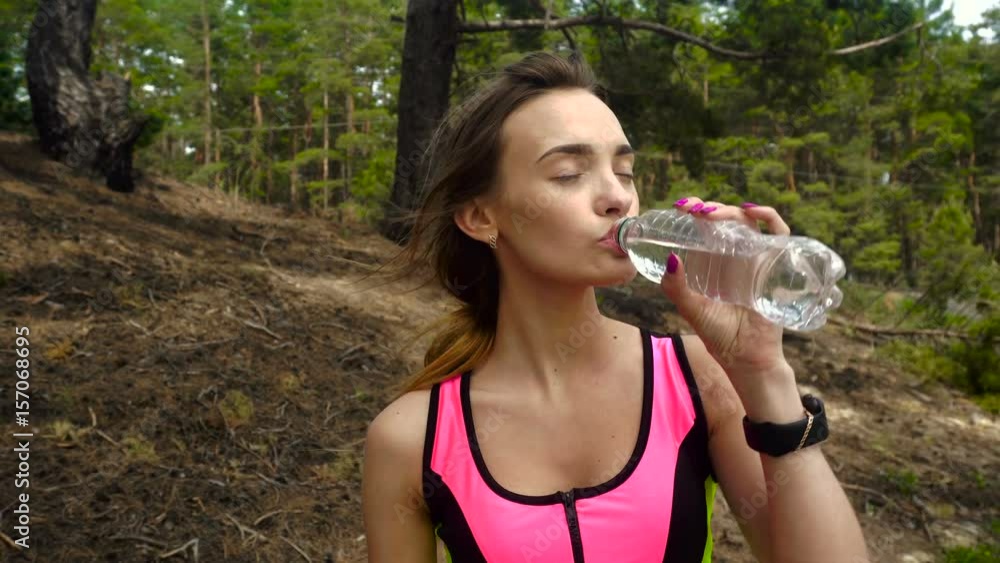 young beautiful sport girl drinks water young beautiful sport girl drinks water