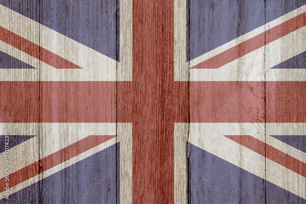 Fototapeta premium A rustic old British flag on weathered wood