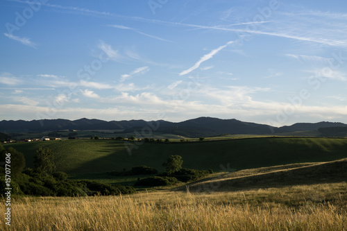 Sunset on meadow with hills and tree. Slovakia