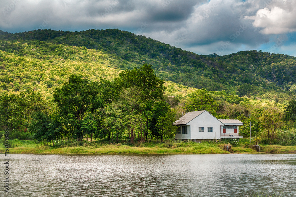 A white house and mountain and lake A white house and mountain and lake