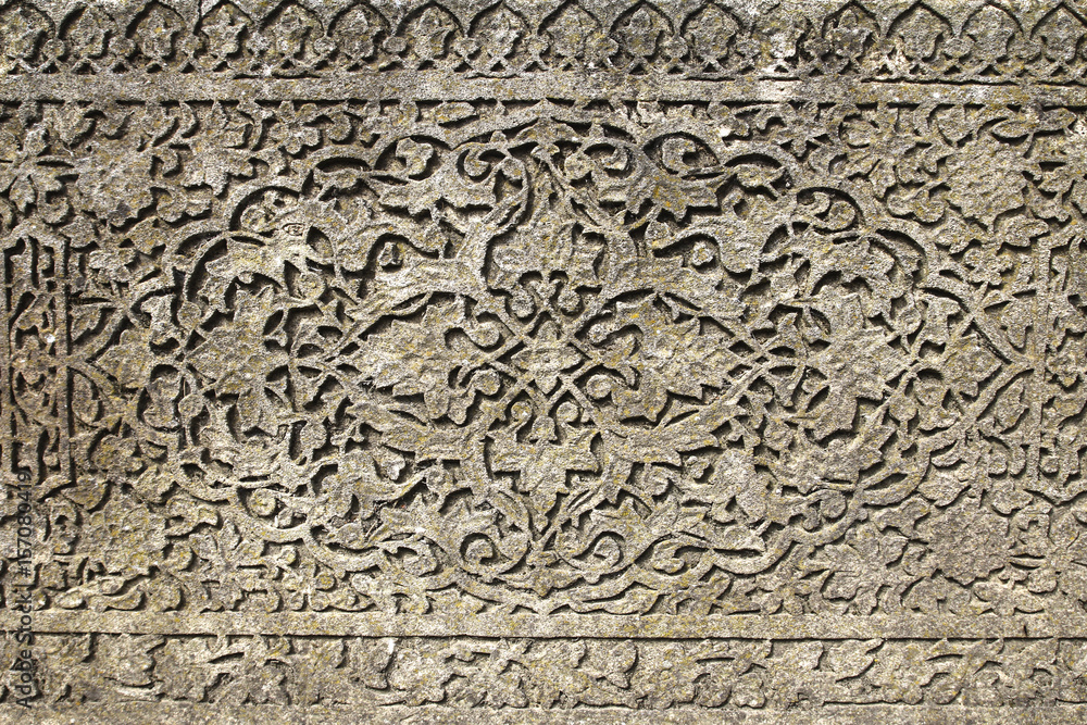 Arabian drawings and inscriptions are made on a very ancient stone