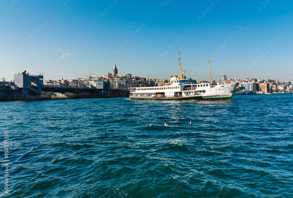 View of  Galata Tower, Galata Bridge  in Karakoy quarter of Istanbul. Ferries float on Golden Horn waterway.Bosphorus.Turkey.