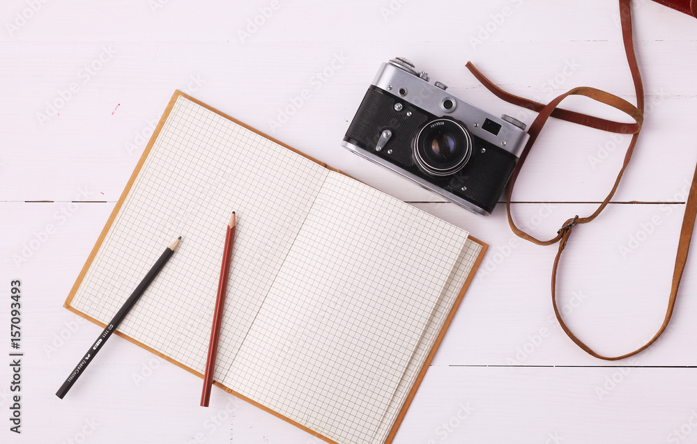 Fototapeta premium Flat lay woman clothing and accessories placed on a wooden background