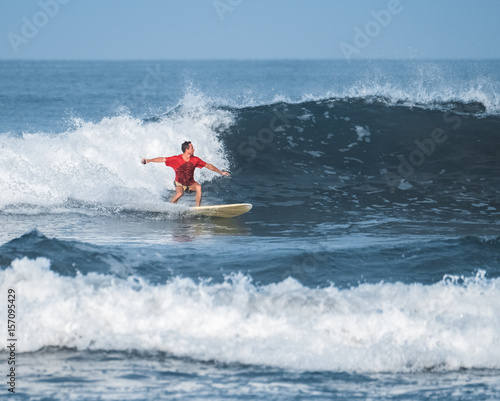 Man surfs in an ocean