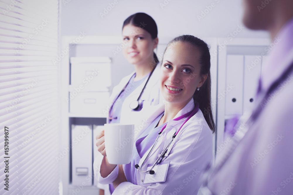 Young team or group of doctors standing in hospital Young team or group of doctors standing in hospital