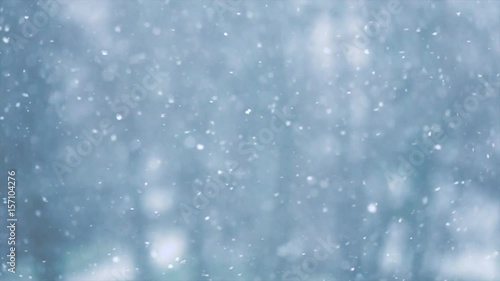 Snow flakes falling in slow motion photo