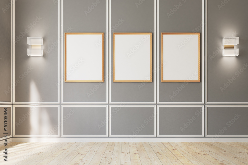 Three framed posters on gray wall Three framed posters on gray wall