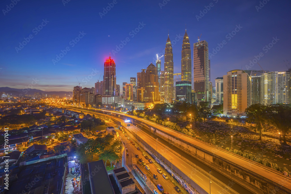 Aerial view of Kuala Lumpur city skyline during blue hour dawn