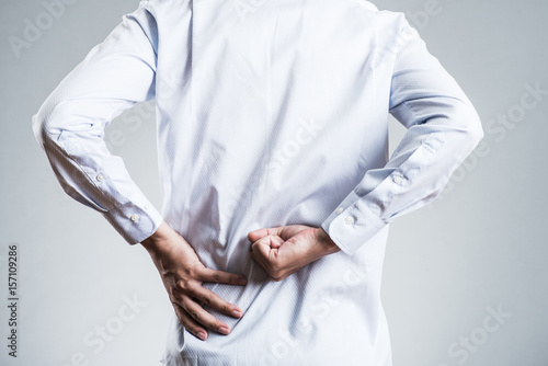 Cuadro en lienzo 男性,腰痛