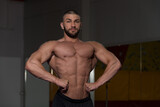 Muscular Body Builder Showing His Front Lat Spread