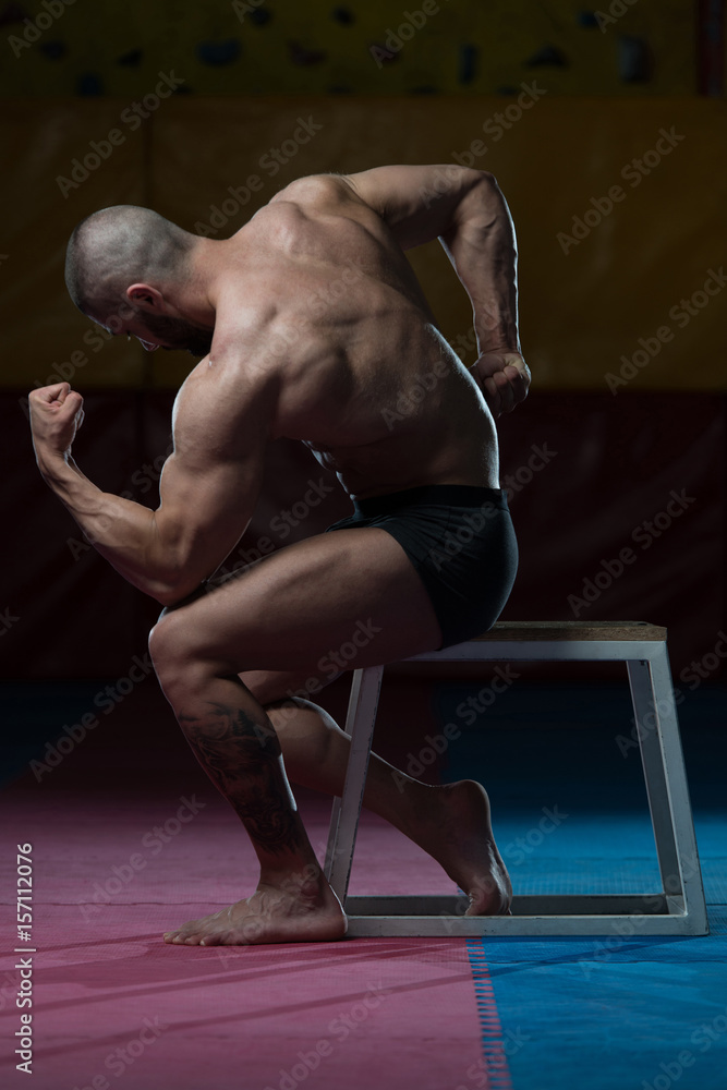 Fototapeta Male Body Builder Showing His Body