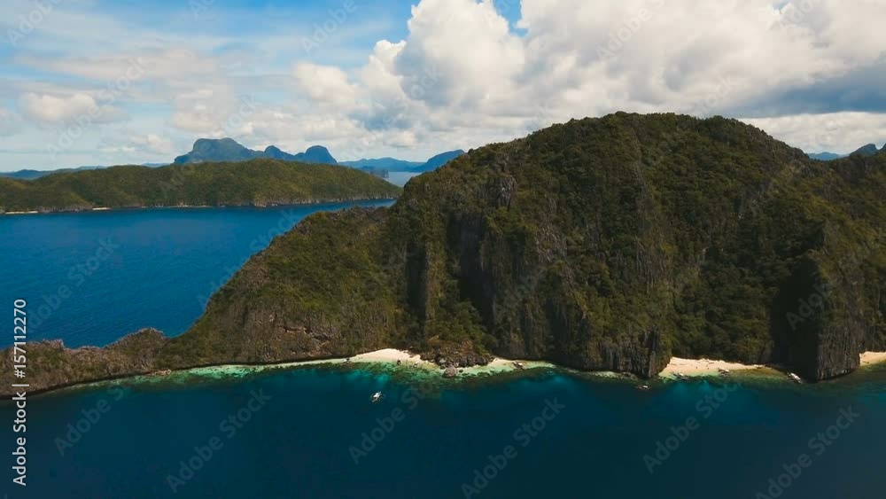 Tropical islands, aerial view. Aerial view: sea and the tropical island. Tropical bay in El Nido. Archipelago El Nido.Sandy beaches of the wild islands. Philippines National Marine Park. Aerial video