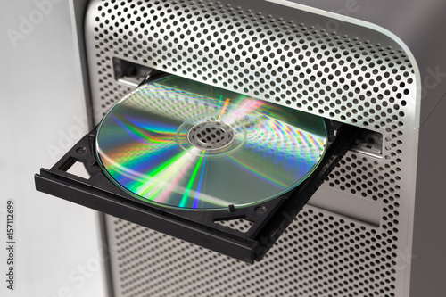 DVD CD ROM on a computer opened to show disc photo
