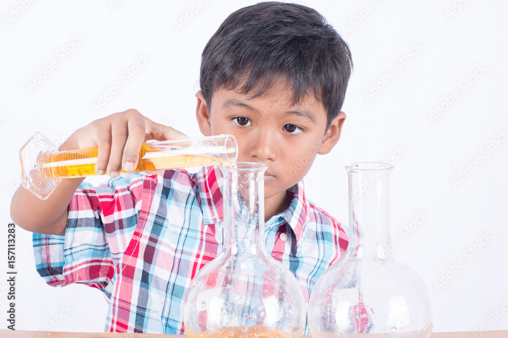 Cute little boy doing science experiment, science Education Cute little boy doing science experiment, science Education