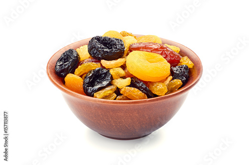 Bowl of dried fruits mix on white