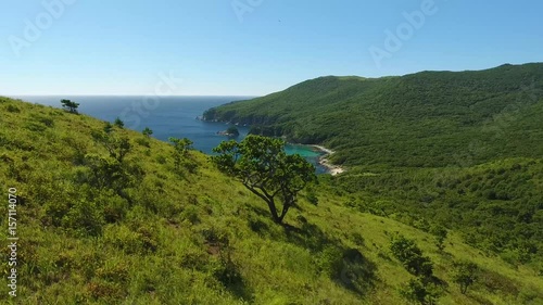 Dynamic Fast flight drift to Bay of Languishing Heart. Far East Marine Biosphere Reserve Primorsky Krai Vladivostok Russia. Unique National park Japan Sea ocean. Aerial Helicopter Drone flight. 4k photo