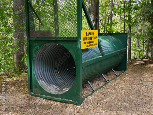 humane live trap for catching bears in a park photo