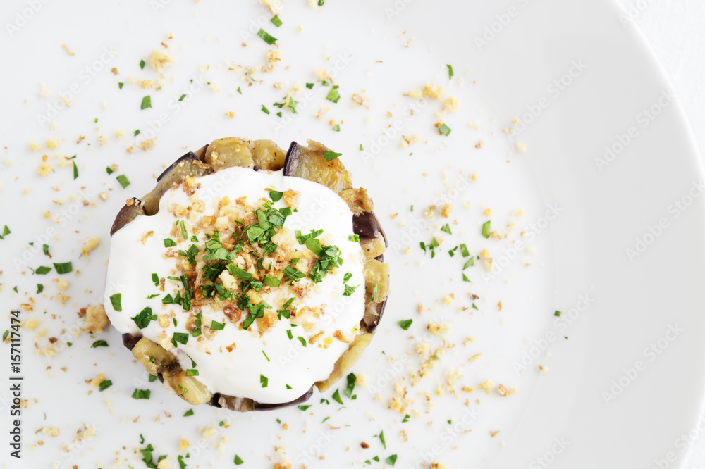 yogurt sprinkled with parsley and walnut on warm salad of fried with garlic spicy guinea squash yogurt sprinkled with parsley and walnut on warm salad of fried with garlic spicy guinea squash