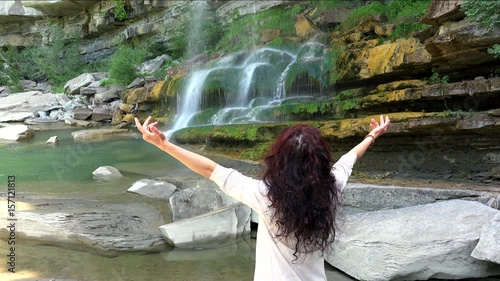 woman with open arms as hugging nature photo