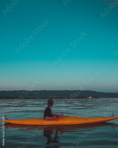 lonley kayaker with mountain view