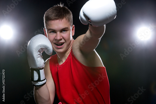 Young boxer in red form