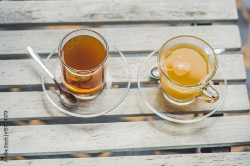 Tangerine tea on a table in a cafe photo