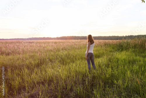 Beautiful blondie lady in field at sunset, feels happy. Instagram
