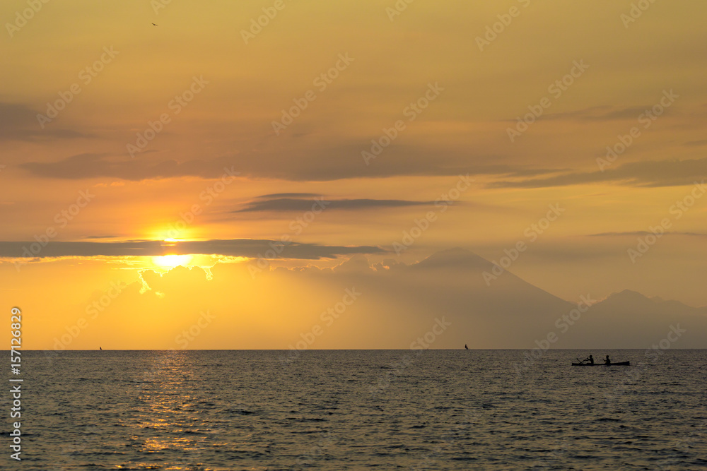 Fototapeta premium Traditional fisherman during majestic sunset in Lombok, Indonesia