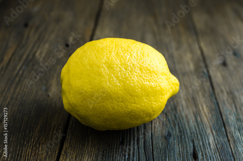 Lemon on old wooden background.