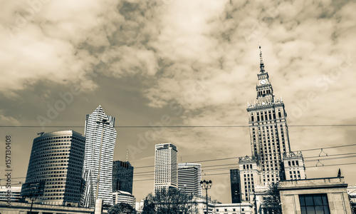 Panorama of Warsaw with modern skyscrapers on a sunny day overlooking the Palace of Culture. Old retro vintage style photo.
