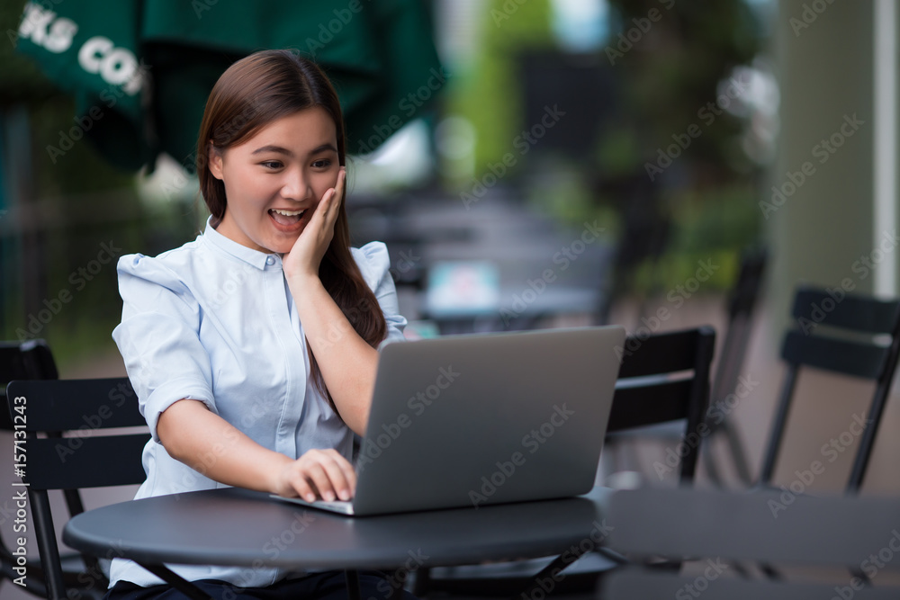 Woman using laptop at cafe she feel surprise Woman using laptop at cafe she feel surprise