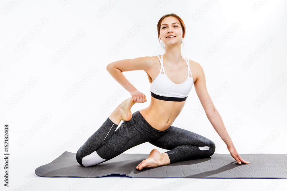 Brunette doing exercises on mat Brunette doing exercises on mat