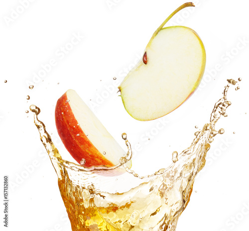 apple slices falling into splashing juice 