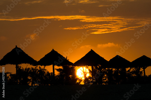 Sunrise over beach rest pavillion in Lombok island, Indonesia