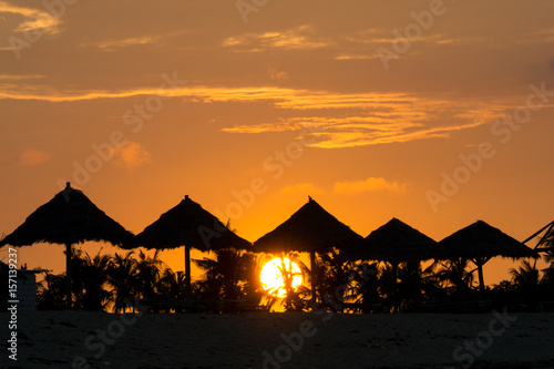 Sunrise over beach rest pavillion in Lombok island, Indonesia