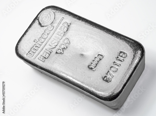 Cast silver bar weighing one kilo. The surface of cast silver bar. On a white background..