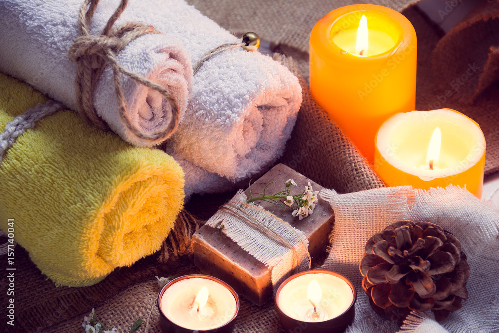 SPA consist from towels, candles, soap, flowers, and fir cone SPA consist from towels, candles, soap, flowers, and fir cone