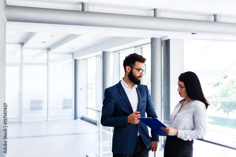 Business couple discussing about their job and planing how to success Business couple discussing about their job and planing how to success