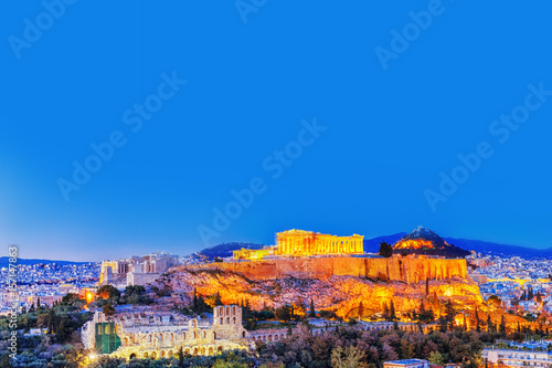 Parthenon and Herodium construction in Acropolis Hill in Athens, Greece. Twilight scenery.