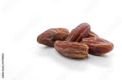 dried date palm fruit isolate on white background, ramadan kareem food