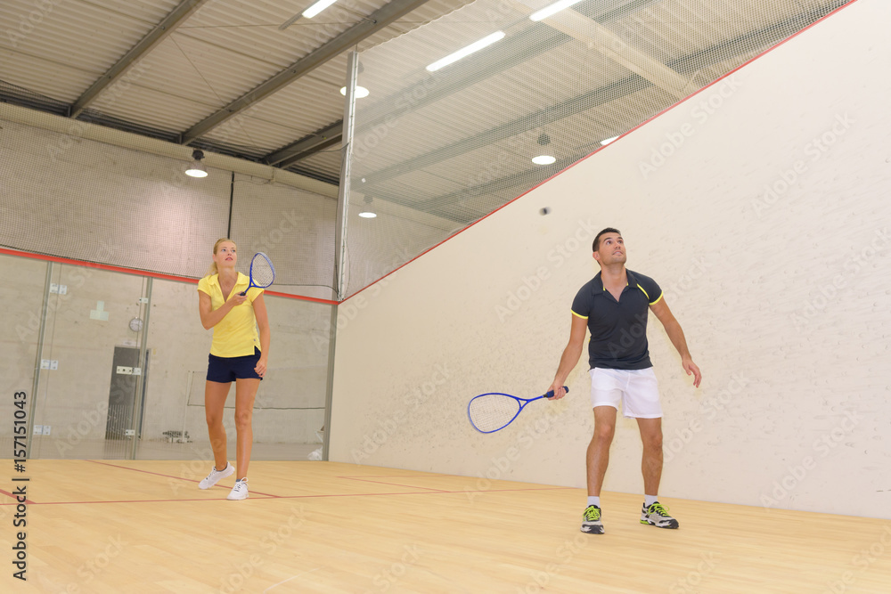 couple playing squash